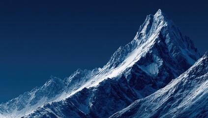 Majestic snow-capped peak against a deep blue sky (1)