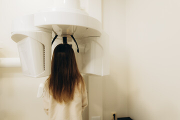 Patient undergoing a dental panoramic radiography exam
