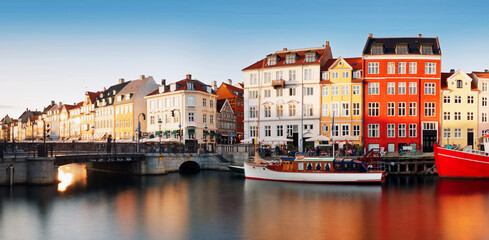 Cityscape of downtown Copenhagen city skyline in Denmark at famous old Nyhavn port at sunset