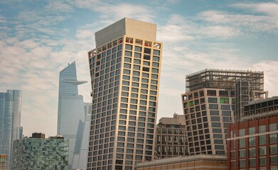 Modern leaning skyscrapers in New York City with Hudson Yards in the background