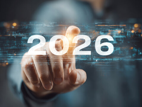 Close-up of a hand pointing at glowing digital "2026" numbers, surrounded by futuristic HUD graphics, representing technology, innovation, and the future. ai generative