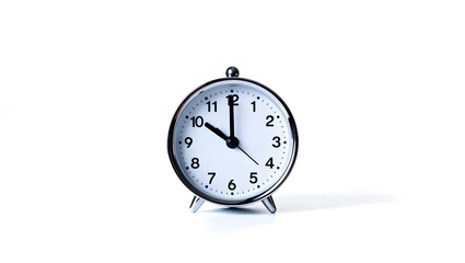 Classic oval alarm clock showing ten oclock on white background