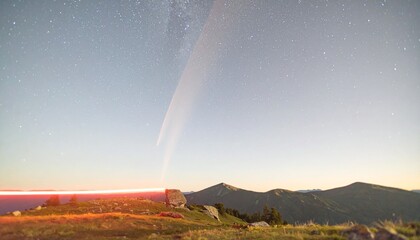 Long red light trail leaving a comet-like tail, motion blurred to one side, backlit
