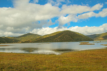 Colorful hills and blue lakes create a serene panorama
Pudacuo National Park, Yunnan, China, Shangri-La
