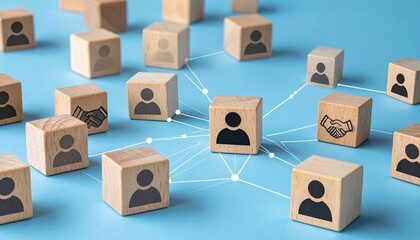 Wooden blocks with icons forming a connected network, central figure linked to others on blue surface.