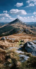 Majestic Mountain Peak Under Blue Sky and Clouds