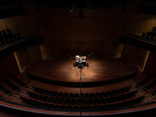 Grand concert hall interior with piano prepared for musical performance