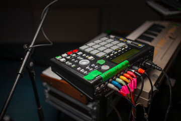 Professional sampler device with colorful cables for electronic music creation and performance