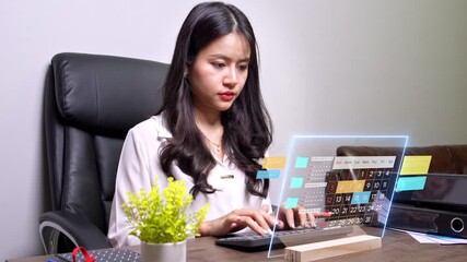 Professional Asian businesswoman managing a project schedule on a futuristic holographic calendar, planning appointments and deadlines with augmented reality technology in a modern office. - Powered by Adobe