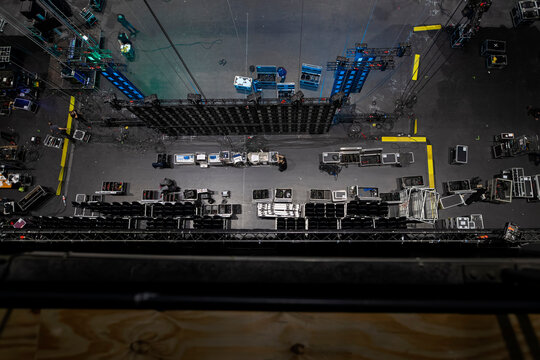 Top-down view of professional audio and video equipment cases arranged for concert production