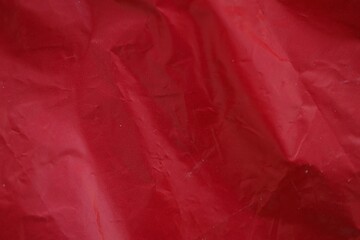 Texture of Red plastic bag smooth crumpled surface