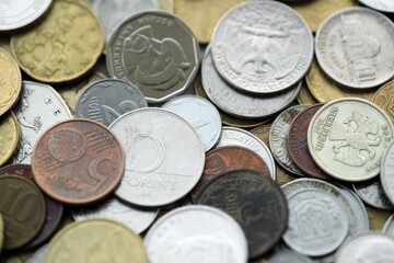 Big pile of different coins from various currencies and different countries around the world....