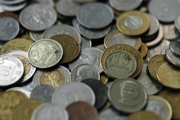 Big pile of different coins from various currencies and different countries around the world....