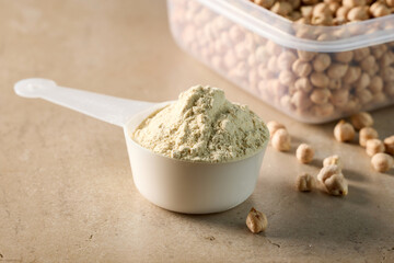 protein powder in scoop.  peas sports nutrition. dry mixture for preparation of sporting or dietary drink.
