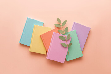 Top View Pastel Books Flat Lay with Green Leaves
