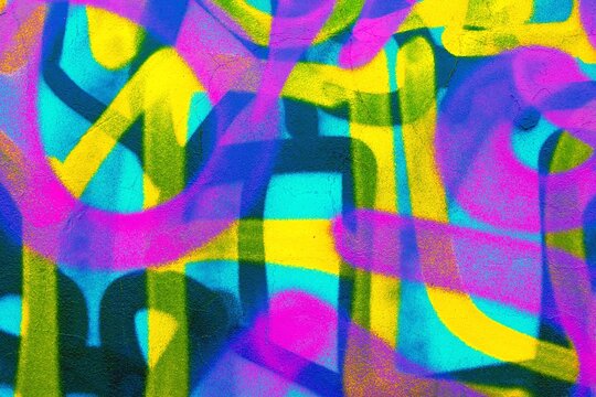 Vibrant graffiti pattern in neon pink, blue, yellow. 80s, urban art, with bold strokes and dynamic colors. Street art, murals, digital backgrounds, modern 80s urban visuals.