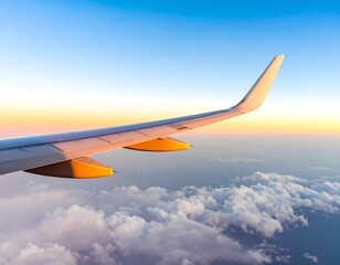 Fototapeta premium Airplane wing over clouds at sunset