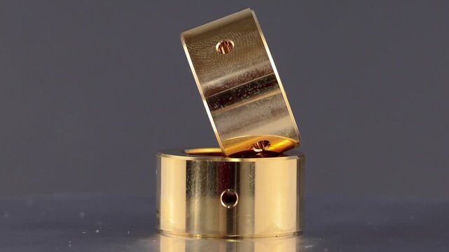 Bearing journal turbocharger, Sintered bronze bushing with internal holes.on rotating display.