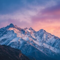 Fototapeta premium Minimalist scenic landscape of snow-capped mountains under a stunning gradient sky, serene and tranquil nature background, peaceful wilderness, calm horizon, winter alpine scenery