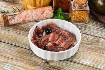 Canned anchovy with oil in the bowl