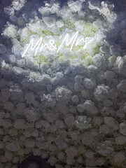 Romantic Mr and Mrs Neon Sign on White Rose Wall