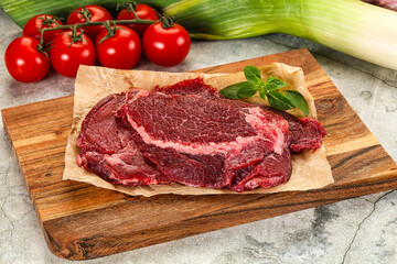 Raw beef cheeks cut for cooking