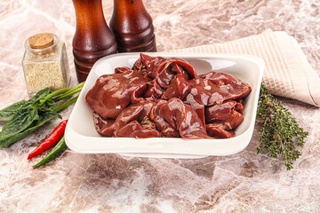 Raw uncokked chicken liver in the bowl