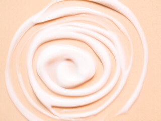 Blur Lotion on pink background, texture cream sunscreen moisture for body,  creamy smudge makeup treatment skincare beauty aesthetic product close up.