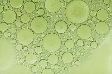 Macro microscope green bubble texture, Close-up Green bubbles and drops oil background . blue green...