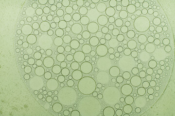 Macro microscope green bubble texture, Close-up Green bubbles and drops oil background . blue green...