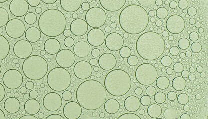 Macro microscope green bubble texture, Close-up Green bubbles and drops oil background . blue green water bubbles, close up golden oil drop for cosmetic