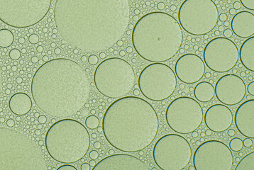 Macro microscope green bubble texture, Close-up Green bubbles and drops oil background . blue green...