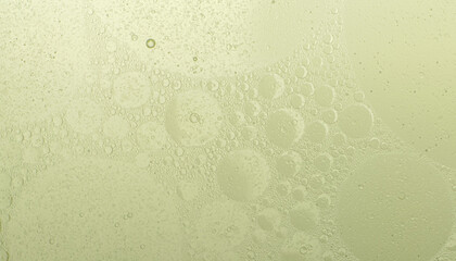 Macro microscope green bubble texture, Close-up Green bubbles and drops oil background . blue green water bubbles, close up golden oil drop for cosmetic