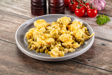 Scrambled egg omelet with green peas