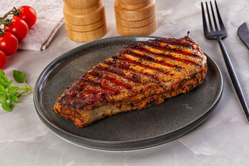 Grilled pork steak with bone