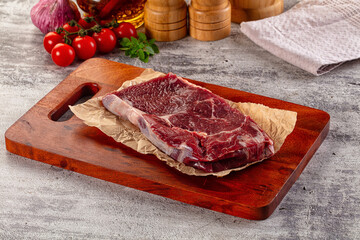 Gourmet raw rib eye steak