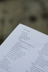 Obraz premium A close-up of an open medical textbook, showing detailed text and diagrams about human physiology and biology. This image represents study, education, research, and the journey of a medical student.