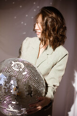 Brunette girl with disco ball