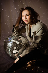 Brunette girl with disco ball