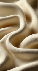 Soft, creamy fabric draped in gentle waves, showcasing texture and subtle light play