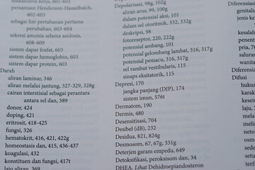 Fototapeta premium A close-up of an open medical textbook, showing detailed text and diagrams about human physiology and biology. This image represents study, education, research, and the journey of a medical student.