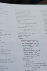 Obraz premium A close-up of an open medical textbook, showing detailed text and diagrams about human physiology and biology. This image represents study, education, research, and the journey of a medical student.