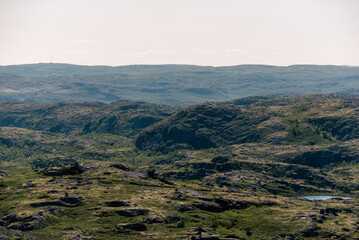 Naklejka premium landscape Russian North view in the tundra with a mountain river and a lake in the mountains
