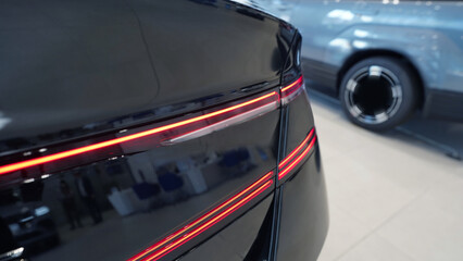 Sleek Hybrid and Futuristic Cars Displayed in Modern Auto Showroom