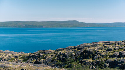 landscape Russian North view in the tundra with a mountain river and a lake in the mountains