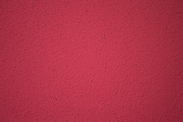 Crimson Surface: A close-up shot revealing a textured, saturated crimson surface, where shadows play gently across the tiny details of the surface.