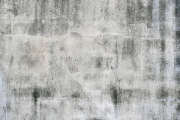 Weathered Concrete Wall: A close-up shot of an aged, textured concrete wall showcasing the effects of time, displaying intricate patterns, cracks, and the subtle nuances of its gray surface.