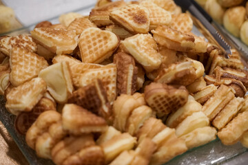 mini waffle cakes served on a large plate.