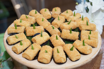 Market snack cakes consisting of risol, onde-onde, sponge cake, donut cake and chocolate filled cake.