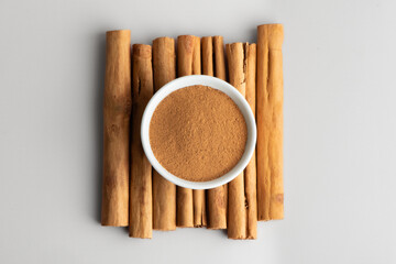 Ceylon cinnamon sticks and ground cinnamon aromatic spice. Cinnamon sticks and powder also known as Dalchini dust.	